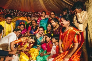bride groom and whole family enjoying the games at Telugu Hindu wedding